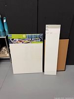 Two canvases and cork board full view