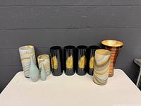 Front view showing all nine vases in lot