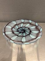 Top view showing complete radial grey and blue pattern of the glass bowl