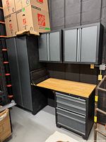 Full view of assembled 5-piece cabinet set showing locker, two wall cabinets, rolling tool chest and bamboo worktop