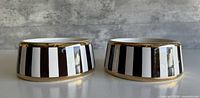 Two Henri Bendel striped ceramic bowls front view