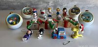 Group shot showing all 16 Peanuts ornaments