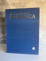 Front of blue slipcase showing title and Apple logo
