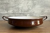 Side profile showing brown exterior and handles