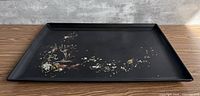 Full view of black Couroc tray showing sea life abalone inlay
