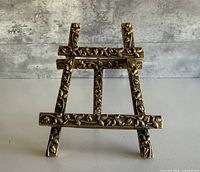 Front view showing full A-frame easel and ornate floral detailing