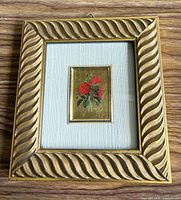 Front view of framed miniature showing frame design and artwork