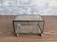 Top view of closed glass and brass footed display box