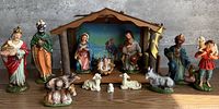 full nativity set with stable and figures arranged