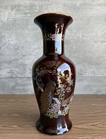 Full view of brown Japanese vase with peacock and floral design