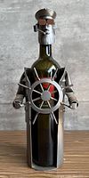 Full view of steel captain wine holder with bottle inserted