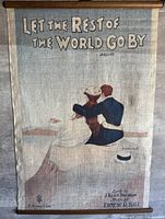 Full view of cloth poster showing artwork, title, and dowels