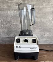 Front view showing base controls and pitcher