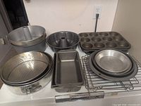 Group shot of pans, muffin tin, bowls, loaf pan, cooling rack