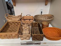 Eight assorted baskets on countertop
