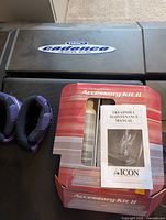 Deck showing Weslo Cadence logo, purple ankle weights, accessory kit box