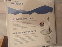 Front of boxed Blue Sky SAG24-C swing-away grill showing branding and specifications