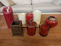 Group shot of all candles and holders on tray