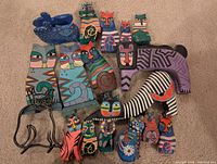 Group shot of all painted wooden cats and wire cats