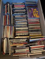 Top view of one storage bin filled with rows of CDs