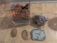 Vase with tumbled stones, two small agate slices and amethyst cluster