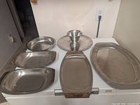 All six Danish stainless steel serving pieces displayed