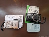 Canon ELPH 180, Canon SX240 HS with manual and Canon charger
