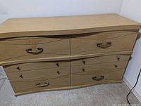 Front view of closed six-drawer dresser