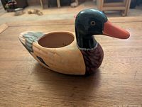 Wooden mallard open container profile view