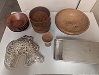 Wooden bowls, wooden goblet, aluminum fish mold and loaf pan