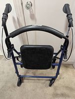 Rear view of Drive rollator walker showing seat, backrest, handles