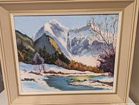 Front view of framed mountain landscape painting