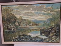 Full view of framed landscape painting