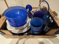 Box of blue bowls, white plates, blue tumblers and stemmed goblets