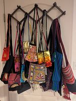 Full set of purses hanging on back of door