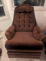 Front view of brown upholstered recliner chair
