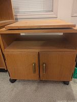 Front view cabinet closed showing doors, casters, swivel top