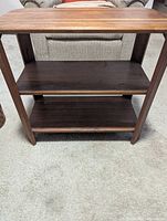 Front view showing three tiers and open sides