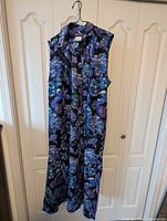 Sleeveless blue-purple floral wool dress on hanger