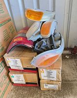 stacked boxed light assemblies with loose lenses on top