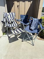 Three folding camping chairs grouped together