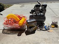 Overall lot with compressor, hoses, spray gun boxes, cords, accessories