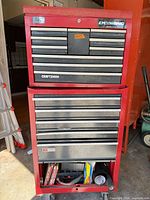 Front view of red Craftsman rolling cabinet and chest showing multiple drawers closed