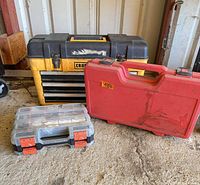 Three storage organizers: Craftsman chest, red case, clear-lid organizer