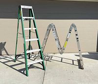 Both ladders fully opened on driveway