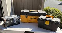 Three main items: boxed Black & Decker inflator, Craftsman Permanex toolbox, modular organizer toolbox