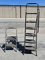 Both ladders standing side by side for scale and comparison