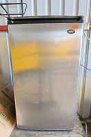 Front view of Sanyo stainless compact refrigerator