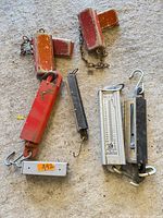 Overview of two pairs wheel chocks and four hanging scales
