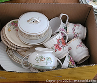 Boxed assortment of cups, plates, covered bowl